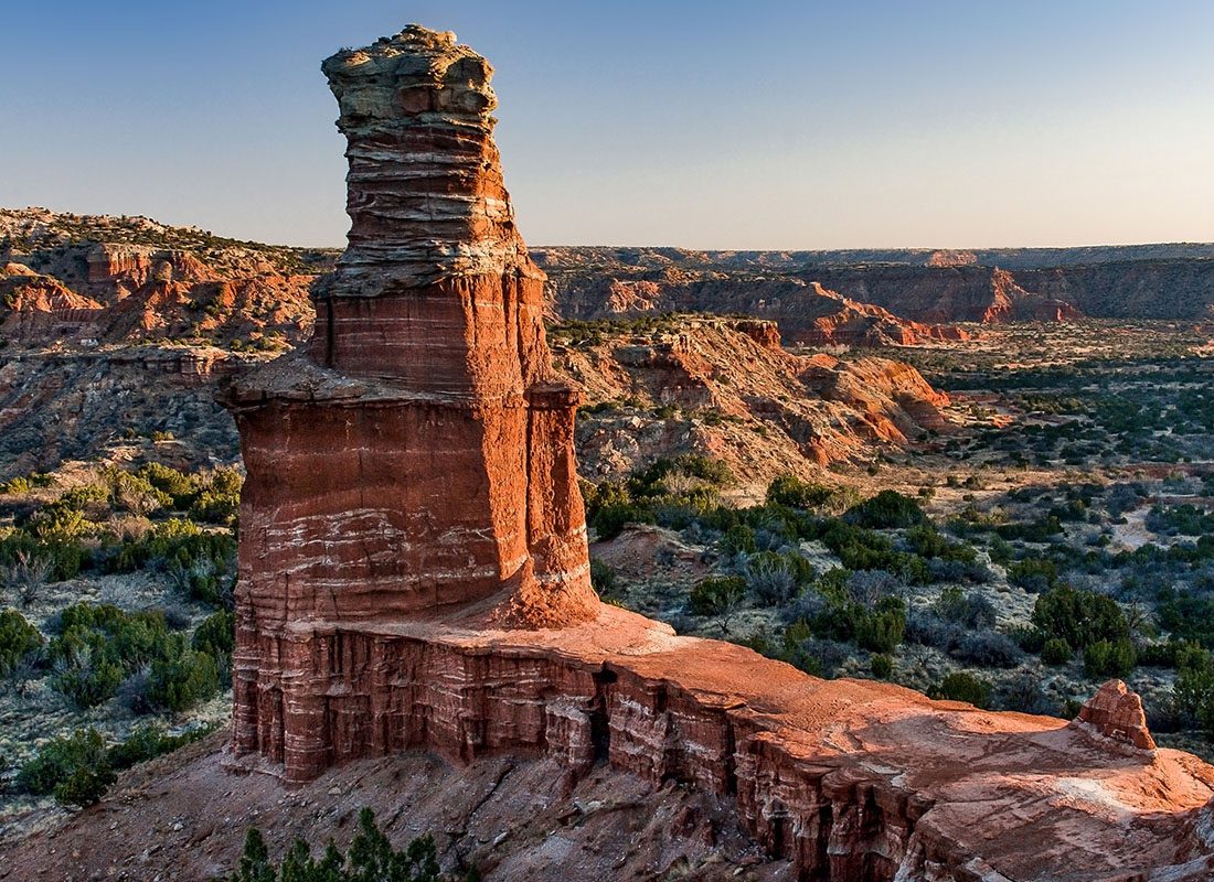 About Our Agency - Rock Formation Lighthouse at the Palo Duro Canyon in West Texas at Sunset with a Clear Sky